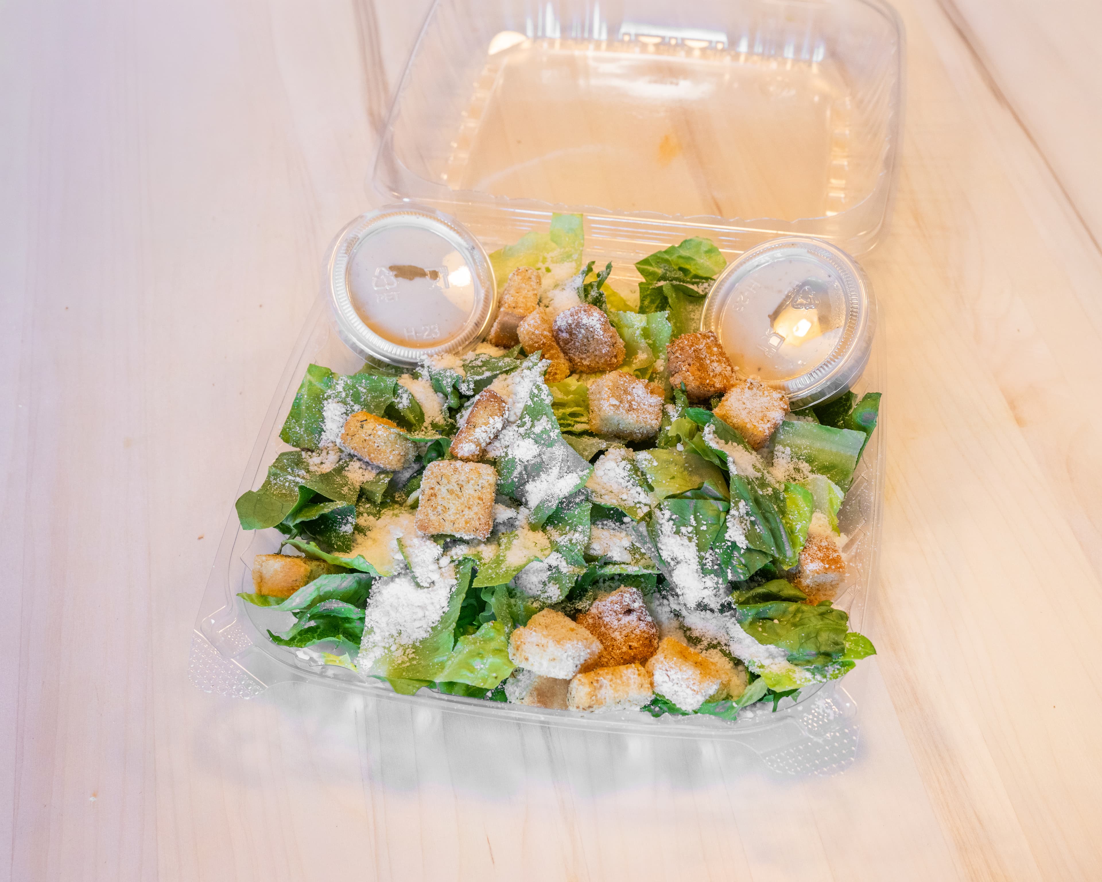 Caesar salad packed for takeout